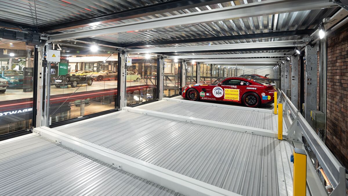 Interior view of the parking system with a sports car parked inside