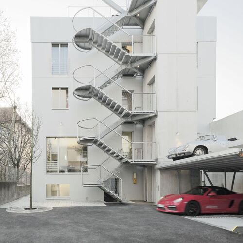 A building on Olgastraße with a car parking system built in front of it