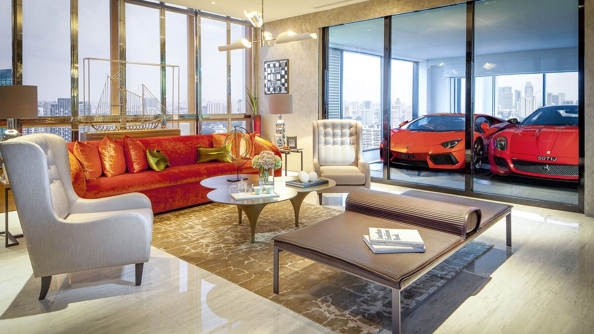 The living room of a flat, with the cars parked in the sky garage